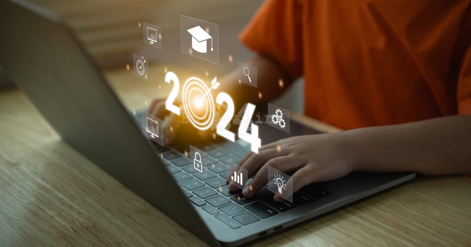 2024 new year trends technology concept. Girl working on laptop virtual display screen of graduation hat, education icons. E-learning Education webinar online courses . Education idea learning online.