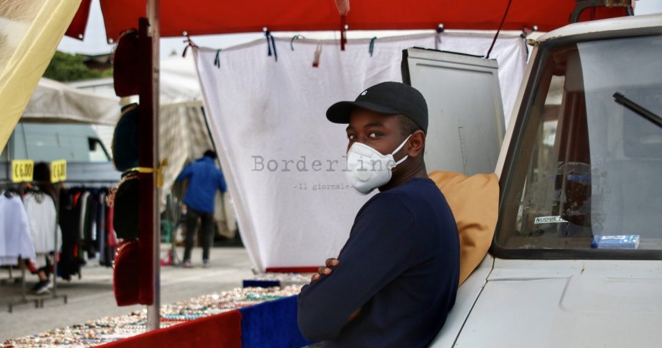 commercio immigranti migrante mercato