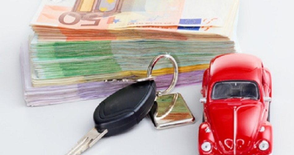 Car with car key and stacked money to show the cost increase