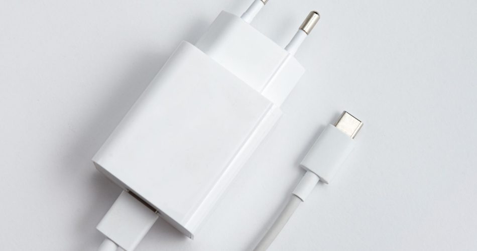 Charger and USB cable type C over white isolated background