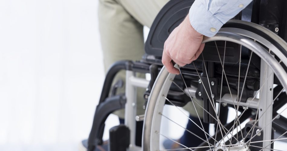 hand-wheelchair-wheel-close-up