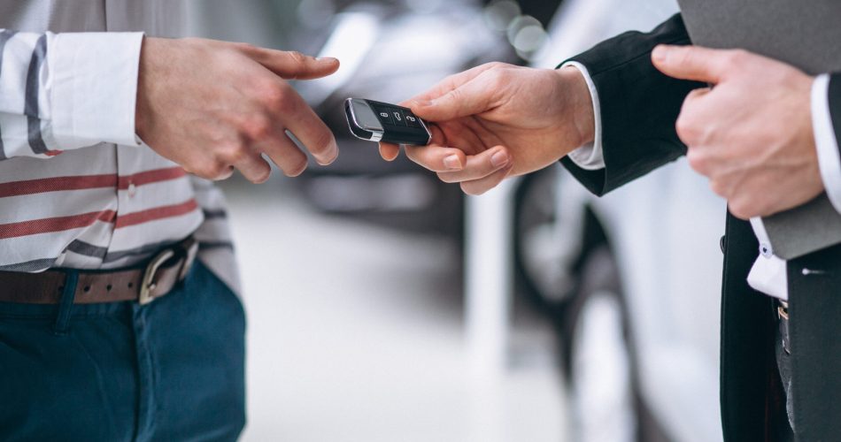 Female hands close up with car keys