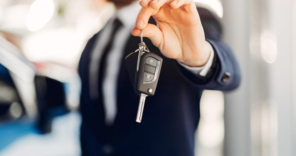 Businessman in a car salon